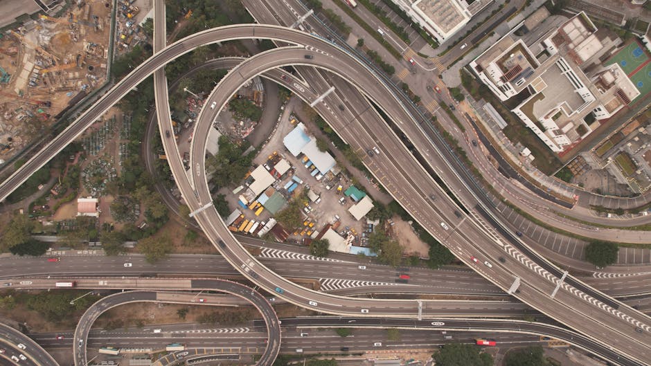 Aerial shot of a highway interchange in Kowloon, showcasing dense urban infrastructure and roadways.